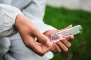 hand with tube glass