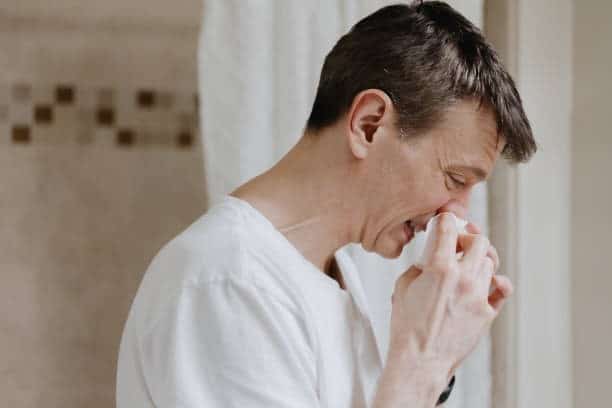 man having allergies